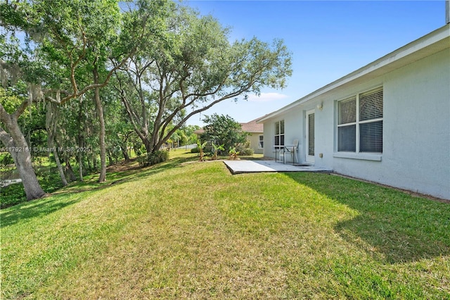 1754 Turtle Rock Dr, Lakeland, FL 33803 - view of yard featuring a patio area