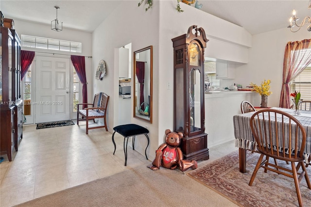 1754 Turtle Rock Dr, Lakeland, FL 33803 - foyer entrance with an inviting chandelier and a wealth of natural light