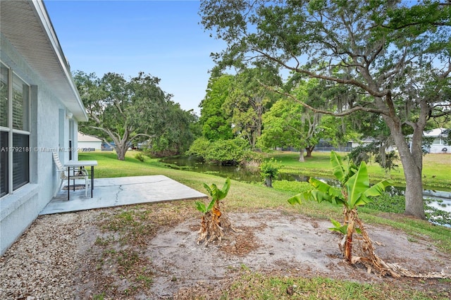 1754 Turtle Rock Dr, Lakeland, FL 33803 - view of yard featuring a patio area and a water view