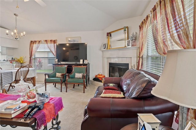 1754 Turtle Rock Dr, Lakeland, FL 33803 - carpeted living area featuring lofted ceiling, a tile fireplace, and a chandelier