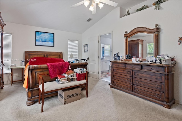 1754 Turtle Rock Dr, Lakeland, FL 33803 - carpeted bedroom with ceiling fan, high vaulted ceiling, visible vents, baseboards, and ensuite bathroom