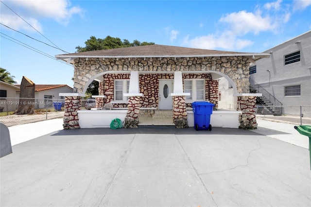 1922 NW 4th St, Miami, FL 33125 - view of patio featuring a porch, stairway, and fence
