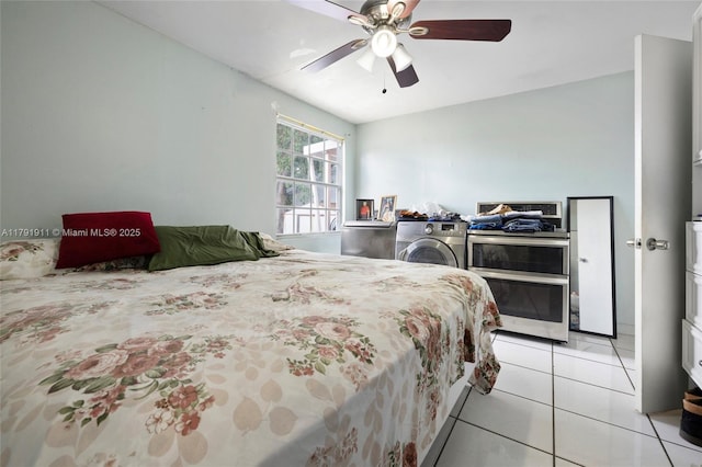1922 NW 4th St, Miami, FL 33125 - bedroom featuring washer / dryer, light tile patterned flooring, and ceiling fan