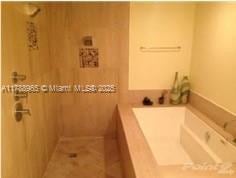 5875 Collins Ave Unit 1006, Miami Beach, FL 33140 - full bath featuring a bath and a shower