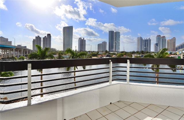 balcony with a view of city and a water view
