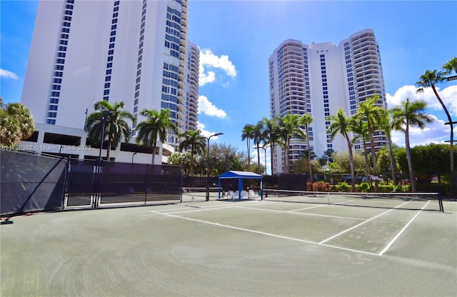 view of sport court with fence