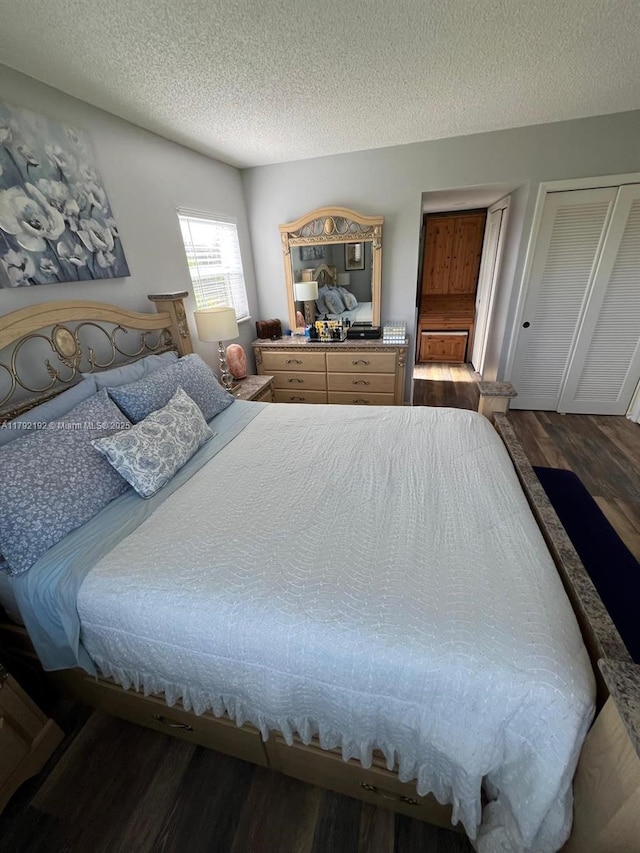 9880 Marina Blvd Unit 1516, Boca Raton, FL 33428 - bedroom with a textured ceiling and wood finished floors
