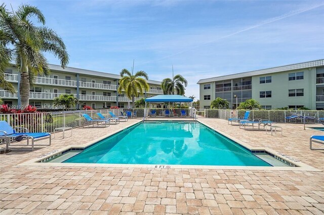 9880 Marina Blvd Unit 1516, Boca Raton, FL 33428 - community pool featuring a patio and fence