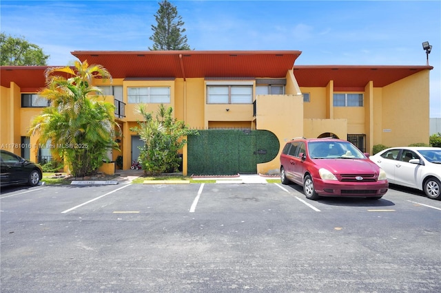 view of property with uncovered parking