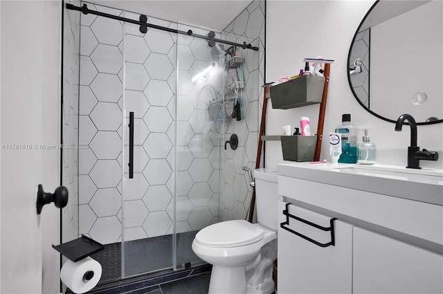 bathroom featuring vanity, toilet, and a stall shower