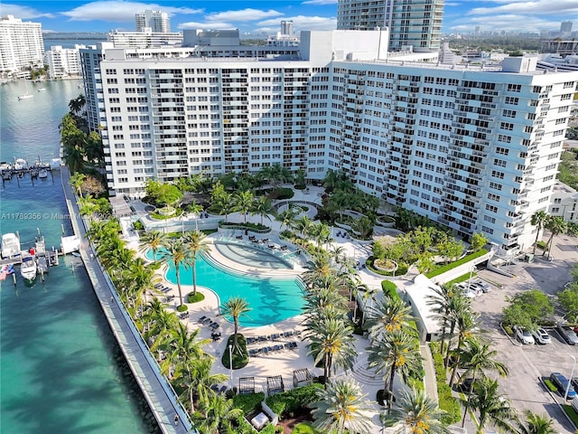 birds eye view of property with a view of city and a water view