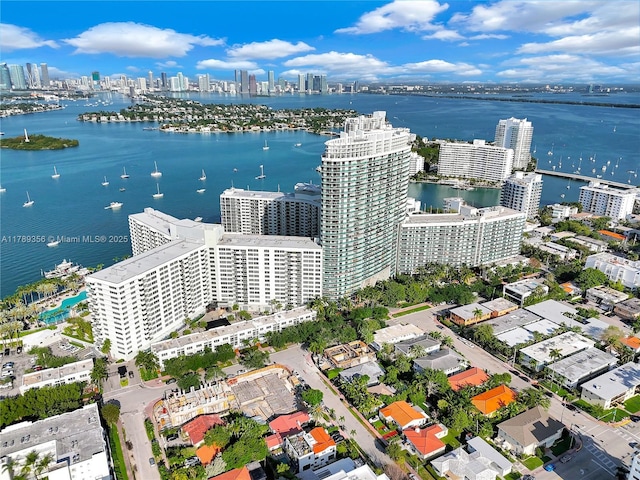 aerial view featuring a city view and a water view