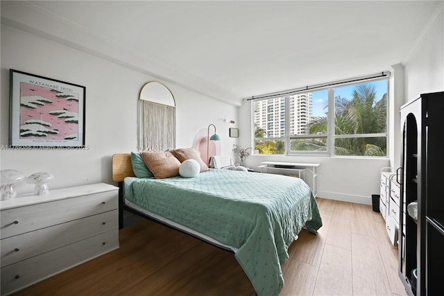 bedroom with light wood-type flooring