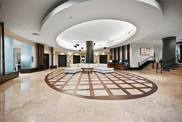 community lobby featuring visible vents and stairs