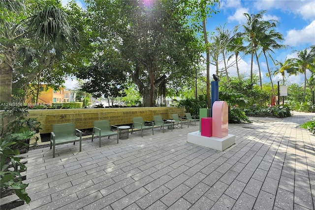 view of property's community featuring a patio area