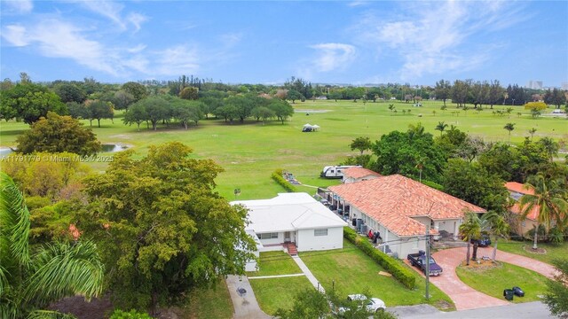 1025 Hunting Lodge Dr, Miami Springs, FL 33166 - aerial view of property and surrounding area with a golf club, a nearby body of water, and a tree filled landscape