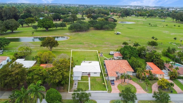 1025 Hunting Lodge Dr, Miami Springs, FL 33166 - aerial view of residential area featuring a large body of water, property parcel outlined, and a golf course