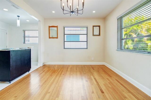 1025 Hunting Lodge Dr, Miami Springs, FL 33166 - unfurnished dining area with plenty of natural light, light wood-style flooring, a chandelier, and recessed lighting