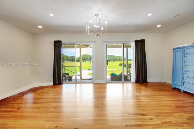 1025 Hunting Lodge Dr, Miami Springs, FL 33166 - empty room featuring light wood-type flooring, a chandelier, baseboards, and recessed lighting