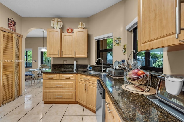 19404 NW 79th Ct, Hialeah, FL 33015 - kitchen featuring a sink, stainless steel dishwasher, light brown cabinetry, arched walkways, and light tile patterned floors