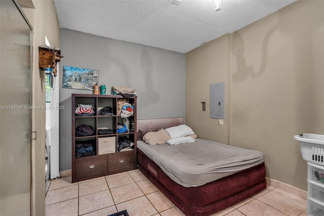 19404 NW 79th Ct, Hialeah, FL 33015 - tiled bedroom featuring electric panel, a textured ceiling, and baseboards