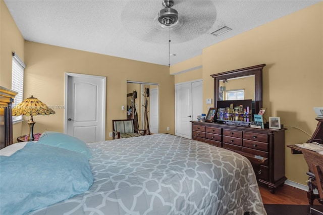 19404 NW 79th Ct, Hialeah, FL 33015 - bedroom featuring a textured ceiling, dark wood-style floors, and a ceiling fan