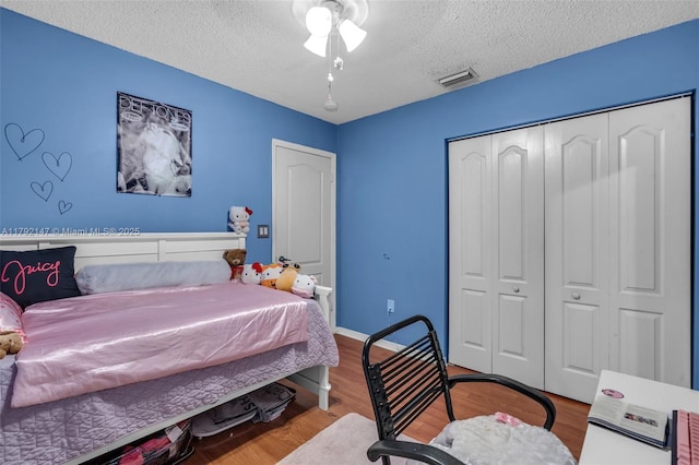19404 NW 79th Ct, Hialeah, FL 33015 - bedroom with a textured ceiling, wood finished floors, and a closet