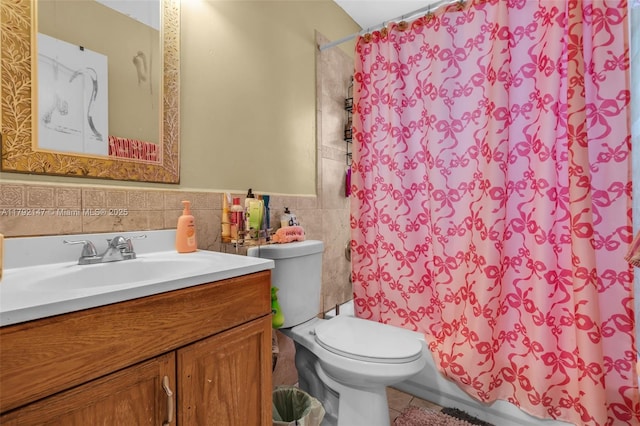 19404 NW 79th Ct, Hialeah, FL 33015 - full bathroom featuring tile walls, vanity, toilet, tile patterned flooring, and wainscoting