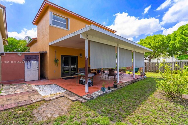 19404 NW 79th Ct, Hialeah, FL 33015 - rear view of property with french doors, a patio, and stucco siding