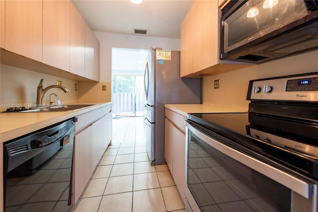862 NW 81st Ter Unit 6, Plantation, FL 33324 - kitchen featuring black appliances, visible vents, light countertops, and a sink