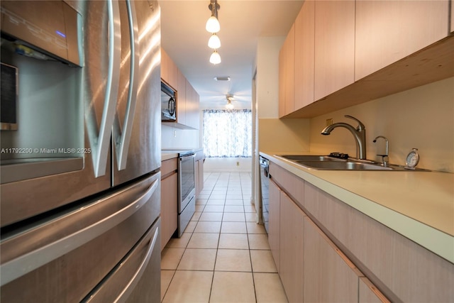 862 NW 81st Ter Unit 6, Plantation, FL 33324 - kitchen featuring light tile patterned floors, stainless steel appliances, light countertops, and a sink