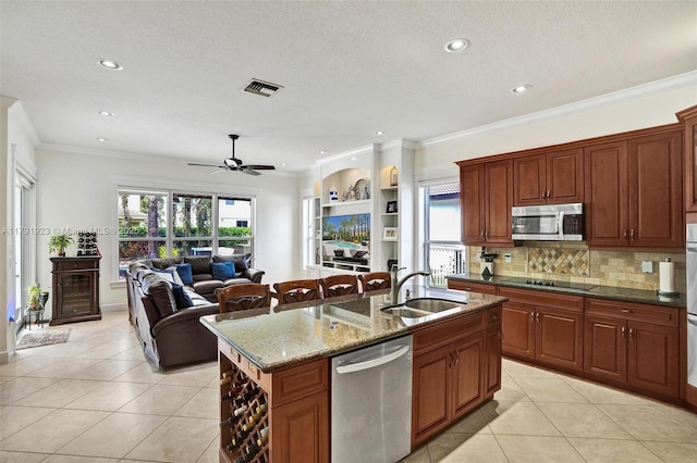 19323 SW 55th St, Miramar, FL 33029 - kitchen with visible vents, light tile patterned flooring, plenty of natural light, a sink, and appliances with stainless steel finishes