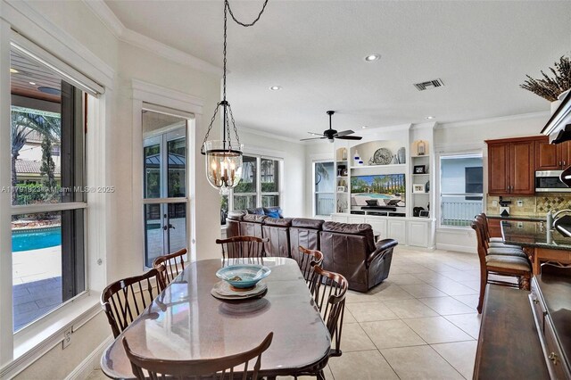 19323 SW 55th St, Miramar, FL 33029 - dining space featuring visible vents, crown molding, ceiling fan with notable chandelier, and a wealth of natural light