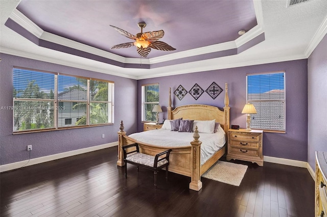 19323 SW 55th St, Miramar, FL 33029 - bedroom featuring crown molding, baseboards, a tray ceiling, and dark wood finished floors