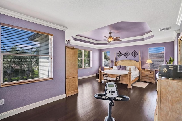 19323 SW 55th St, Miramar, FL 33029 - bedroom with crown molding, baseboards, dark wood-type flooring, a tray ceiling, and visible vents