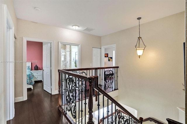 19323 SW 55th St, Miramar, FL 33029 - corridor featuring dark wood-type flooring, baseboards, and an upstairs landing