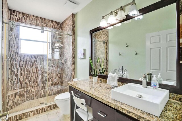19323 SW 55th St, Miramar, FL 33029 - bathroom with vanity, tile patterned flooring, a tile shower, and toilet