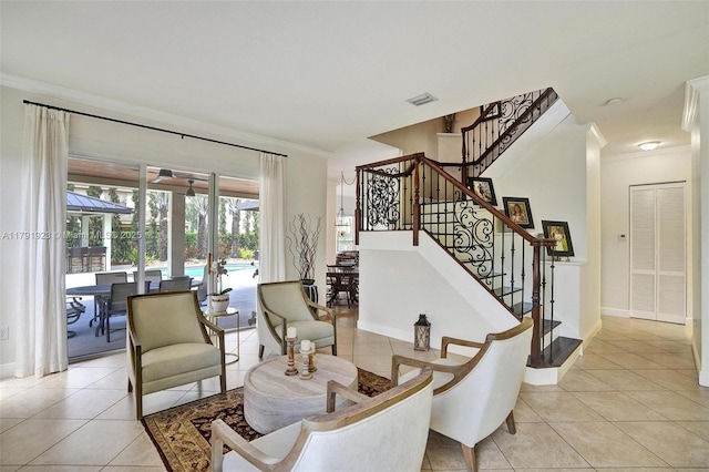 19323 SW 55th St, Miramar, FL 33029 - dining space with visible vents, crown molding, light tile patterned floors, baseboards, and stairway