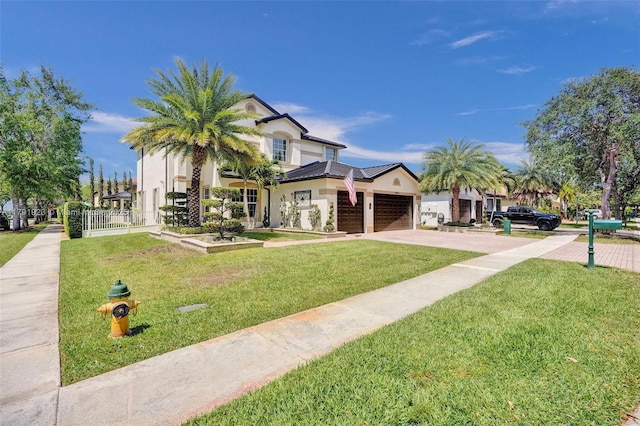19323 SW 55th St, Miramar, FL 33029 - view of front of home featuring a garage, driveway, a front yard, and stucco siding