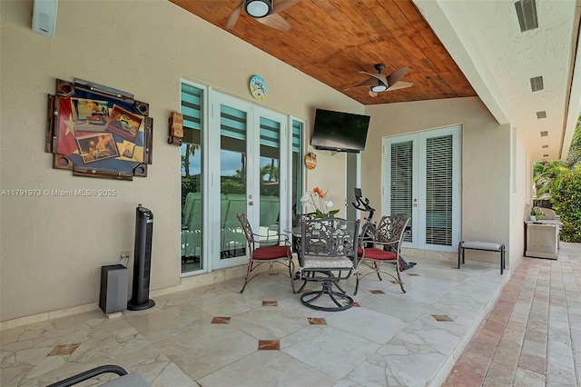 view of patio / terrace with ceiling fan and french doors
