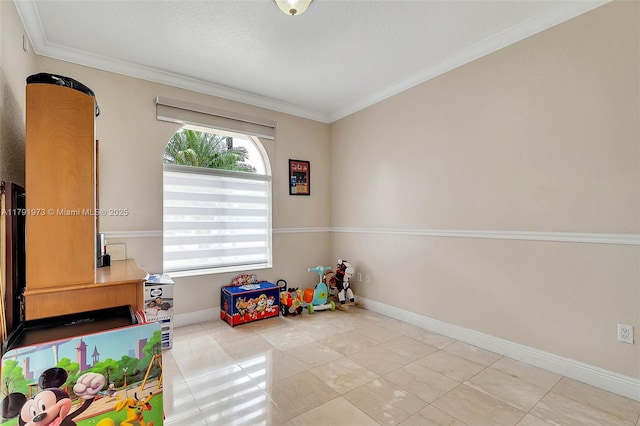 playroom with crown molding and baseboards