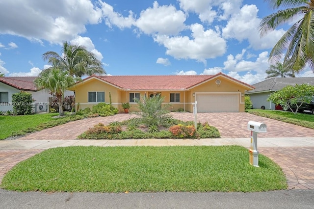 19720 SW 79th Ct, Cutler Bay, FL 33189 - ranch-style house with a garage, stucco siding, a front yard, a tiled roof, and decorative driveway