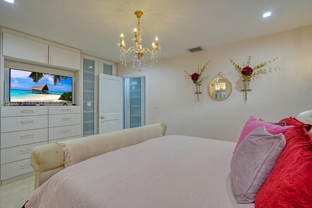 19720 SW 79th Ct, Cutler Bay, FL 33189 - bedroom featuring a notable chandelier and visible vents