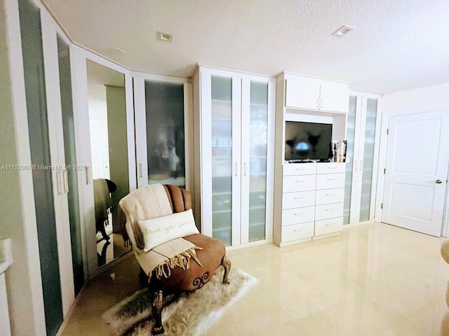 19720 SW 79th Ct, Cutler Bay, FL 33189 - living area with light tile patterned flooring and a textured ceiling