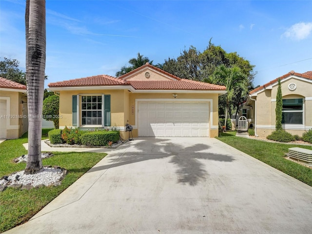 mediterranean / spanish-style house with an attached garage, stucco siding, a tiled roof, and driveway