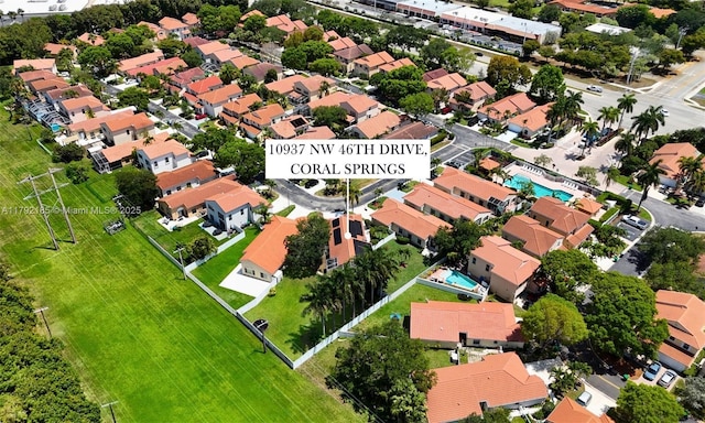 10937 NW 46th Dr, Coral Springs, FL 33076 - aerial view of property and surrounding area featuring nearby suburban area and a pool