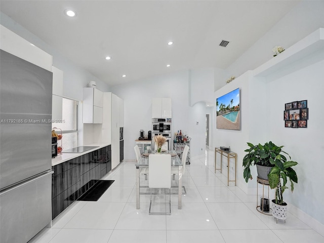 kitchen featuring double oven, light countertops, white cabinetry, visible vents, and modern cabinets