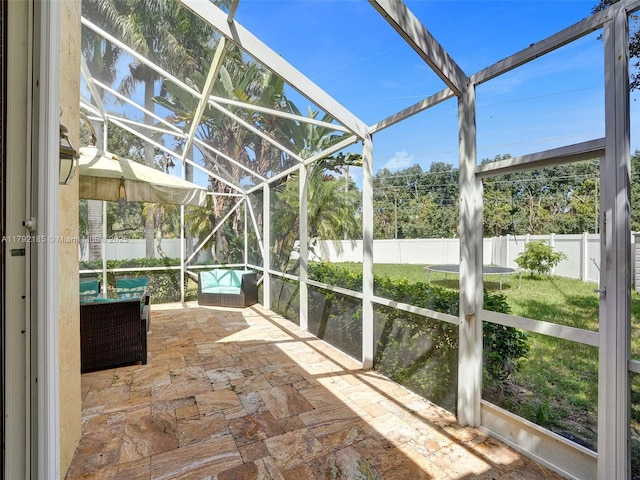 unfurnished sunroom with an outdoor hangout area
