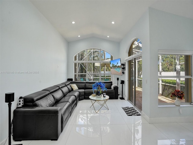 tiled living room with recessed lighting and vaulted ceiling