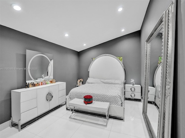 bedroom featuring light tile patterned floors and recessed lighting